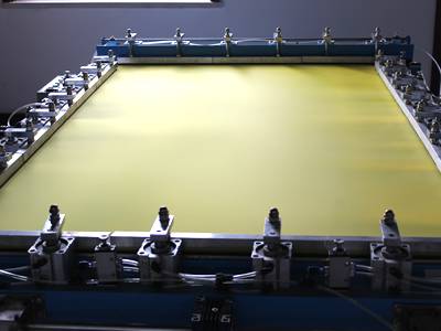 Brass papermaking wire mesh screen on papermaking machine.